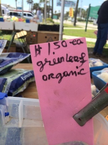 One of the produce stands at the Farmers Market obtains their produce from a farm in Hastings. Since only 30 percent of this produce is organic, the vendor labels the items that are organically grown. 